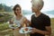 Portrait caucasian woman and asian man enjoy breakfast in side l