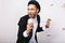 Portrait celebrating karaoke party, happy weekends of excited handsome guy in suit, hat having fun on white background