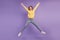 Portrait of charming active energetic funny lady jump have fun on violet background