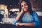 Portrait of charming afro american teenager dressed in red sweatshirt looking at camera