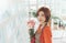 Portrait of charming Asian Korean Woman florist holding a bouquet flowers in hands