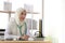 Portrait of charming muslim female doctor working at office desk and smiling