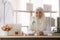 Portrait of charming muslim female doctor working at office desk and smiling at camera