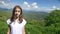 Portrait. charming teen girl on a background of magnificent mountain landscape and blue sky