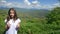 Portrait. charming teen girl on a background of magnificent mountain landscape and blue sky