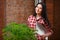 Portrait of a charming young female gardening