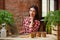 Portrait of a charming young female gardening