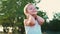 Portrait of a cheerful active child, the child turns his hands behind his head