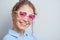 Portrait of a cheerful asian kazakh young woman in stylish glasses dressed casual smiling joyfully isolated on a white background