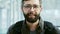 Portrait of a cheerful bearded man smiling at the airport