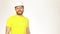 Portrait of cheerful construction engineer or architect in yellow tshirt and hard hat