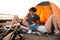 Portrait of cheerful couple relaxing at the camp tent