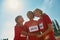 Portrait of cheerful diverse young female athletes wearing t shirts with number standing together, ready for the