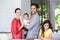 Portrait of cheerful family at desk