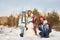 Portrait of a cheerful family with snowman. happy children and parents in the winter outdoors.