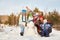 Portrait of a cheerful family with snowman. happy children and parents in the winter outdoors.