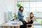 Portrait of cheerful female graphic designers in office. Creative people smiling at the camera during collaborative brainstorming