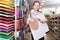 Portrait of cheerful girl tweenager holding school stationery