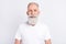 Portrait of cheerful grey hair old man wear white t-shirt isolated on grey color background