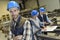 Portrait of cheerful industrial engineer in a factory