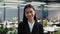 Portrait Of Cheerful Japanese Businesswoman Smiling To Camera In Office