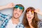 Portrait of cheerful laughing funny young lovers in glasses