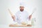 Portrait of a cheerful male chef cook baking