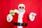 Portrait of cheerful santa claus in eyewear eyeglasses holding keys and paper card building give move house present