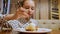 Portrait cheerful teenager girl eating sweet dessert with ice cream in confectionery cafe. Happy girl teenager eating