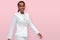 Portrait of a cheerful warm enthusiastic african american business woman CEO entrepreneur isolated on pink background, female empo