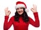 Portrait of cheerful woman wearing santa hat and confident doing ok gesture, isolated