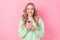 Portrait of cheerful young blogging lady holding case apple iphone device modern interface update isolated on pink color