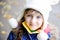 Portrait of cheerfull child girl in white hat