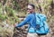 Portrait of a cheerfully smiling African-American Ethnicity young man in sunglasses. He having a walk with a backpack using