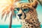 portrait of cheetah in sunglasses on a blurred background of palm trees and the beach