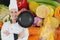 Portrait of chef holding cooking pan with vegetables in background