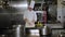 Portrait of a chef in the kitchen of a restaurant, he quickly cuts onions.