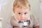 Portrait of a child 1 year old boy in a suit and a bow tie