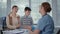 portrait of child boy with mom at a doctor appointment, female therapist measures temperature of little patient with a