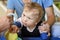 Portrait of a child with cerebral palsy on physiotherapy in a children therapy center. Boy with disability has therapy by doing