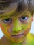 Portrait of child with colors in the face.