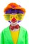 Portrait of child dressed as colorful funny clown