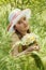 Portrait of child girl with bouquet of daisies