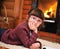 Portrait of a child girl in front of fireplace