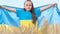 Portrait of a child of a girl raising the Ukrainian blue-yellow flag. The flag of Ukraine. 4k video
