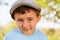 Portrait of a child kid little boy with cap outdoor face outdoor
