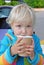 Portrait of a child with a paper cup