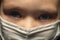 Portrait of a child in a protective mask on his face with a sad look, Covid-19 coronavirus pandemic, virus protection