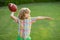 Portrait of child with rugby ball. American football, rugby. Portrait of boy holding american football ball in park.