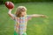 Portrait of child with rugby ball. Kid with american football, rugby ball. Cute portrait of a american football player.